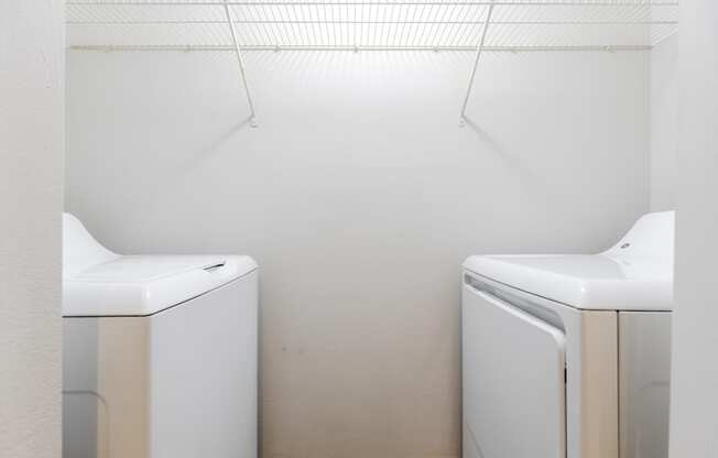 a washer and dryer in a laundry room at Heritage Bay, Jensen Beach Florida