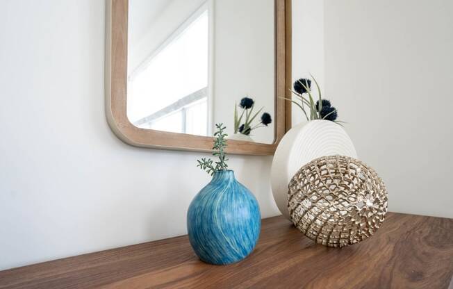 Vase and a decor on a table in front of a mirror  at Hadley Place Apartments, Pennsylvania,