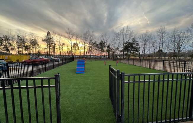 Dog park with a fence at Aurora Apartments