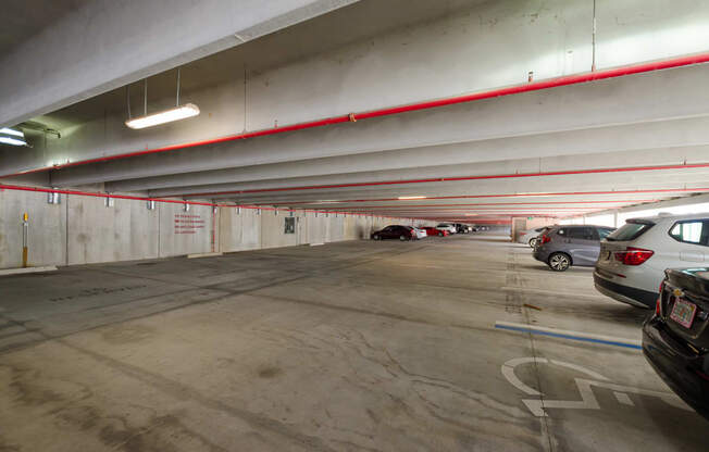 an empty parking garage with cars parked in it