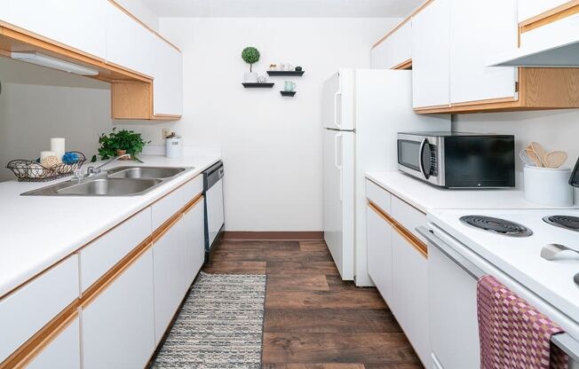 Kitchen island and appliances at Griswold Estates Apartments, Auburn, 46706