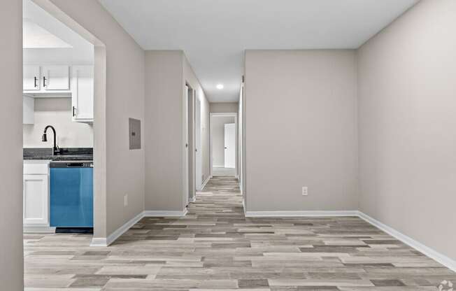 a renovated living room and kitchen in a new home at Bayville Apartments, Virginia, 23455