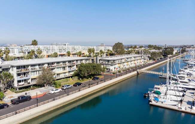 an aerial view of a marina with boats docked in the water and buildings  at Marina Harbor, Marina del Rey