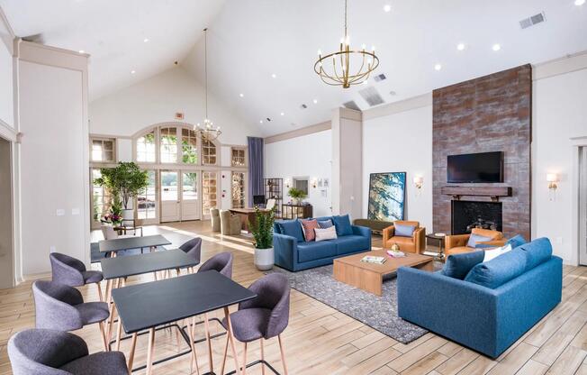 Bright, inviting clubhouse lounge designed for casual conversations, productivity breaks, or simply relaxing fireside.