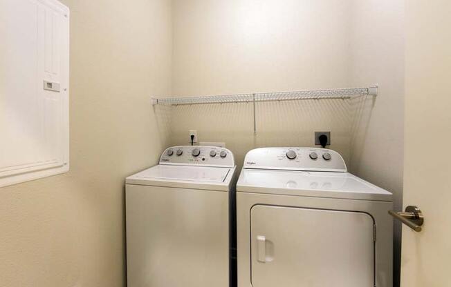 a washer and dryer in a room  at Fusion, Jacksonville, 32256