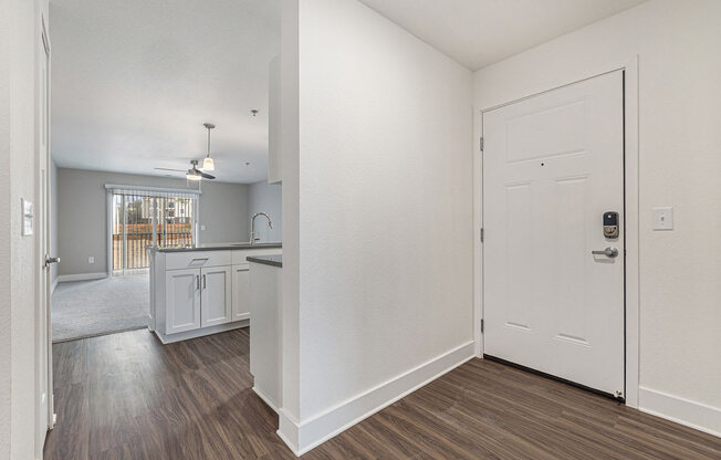 Entry to kitchen and living room with hard surface floors  at Signature Pointe Apartment Homes, Alabama