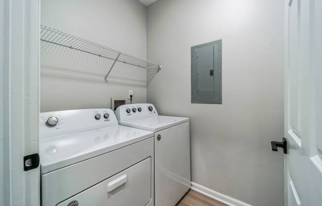 a washer and dryer in a laundry room with a door