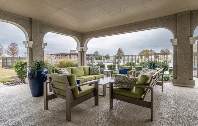 outdoor covered patio with comfortable seating at Villages 3Eighty apartments