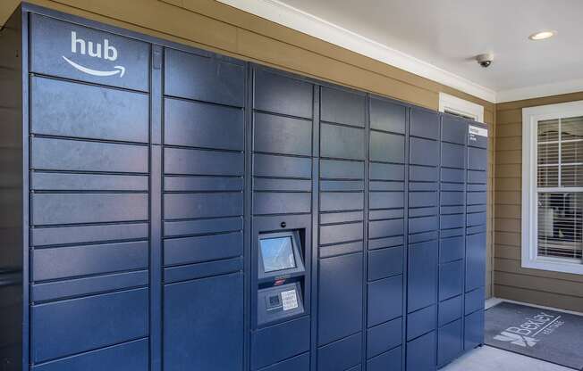 a row of package lockers in a shaded area