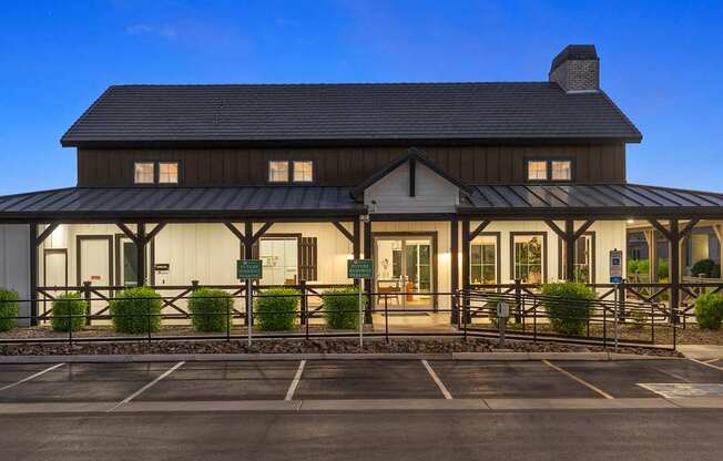 A building with a parking lot in front of it.