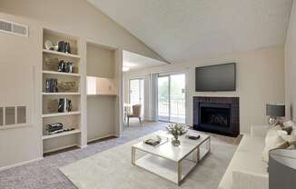 A living room with a fireplace and a television.