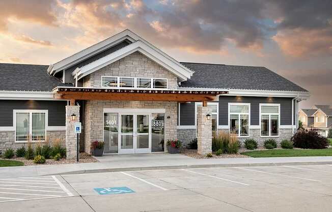 A building with a parking lot in front of it.