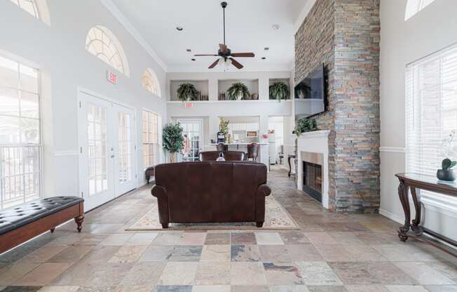 a living room with a couch and a fireplace