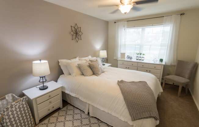 This is a photo of the bedroom of the 1 bedroom, 631 square foot model apartment at Lake of the Woods Apartments in Cincinnati, OH.