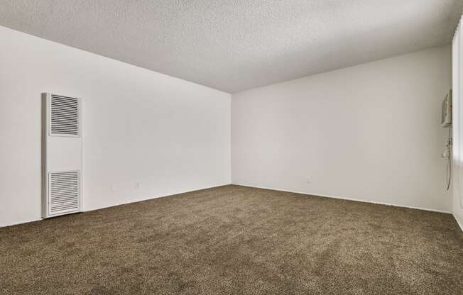 Living room with air conditioning, carpeted floors