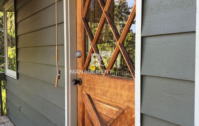 Spacious Multnomah Village Duplex sits amongst a treetop setting. Fenced Backyard. Landscaping Included!