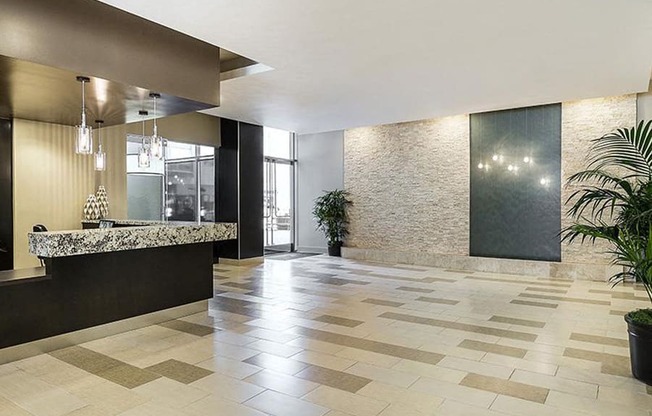 Lobby with front desk and modern interior decoration for apartments near koreatown at Wilshire Vermont, 90010