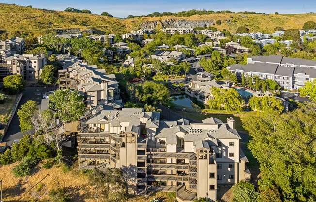 a aerial view of a city with buildings and trees