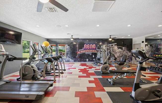 A gym with treadmills and exercise equipment.