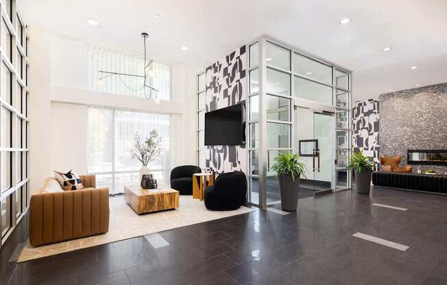 a living room with couches and a tv