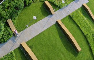 Birds-eye-view of the TFC resident garden with benches, seating, and fun space to relax ourtdoors. 