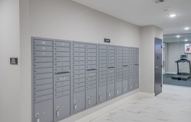 a lockers in a room with a marble floor