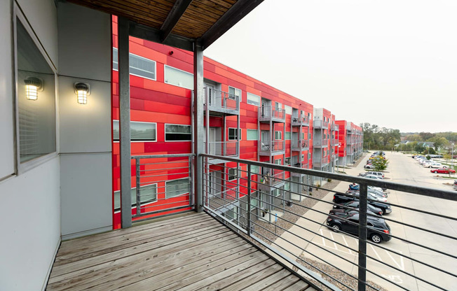 Apartment balcony overlooking River View exterior and parking lot