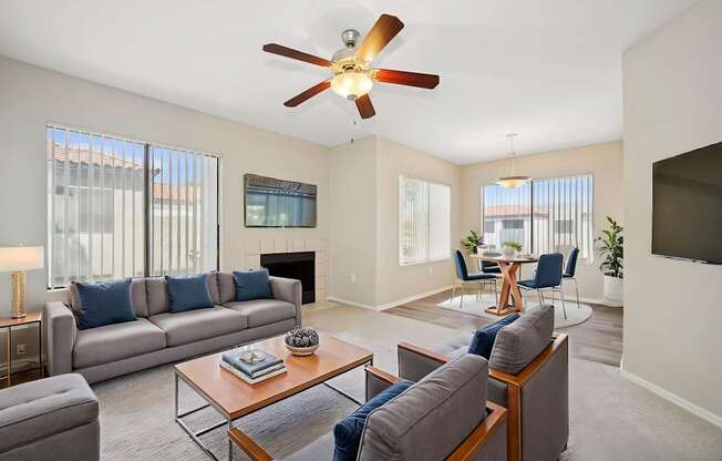 A living room with a grey couch and a coffee table.