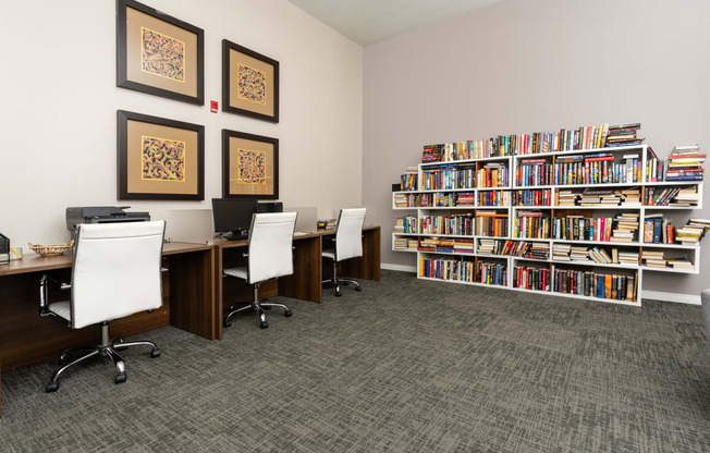 a library with desks and chairs and bookshelves