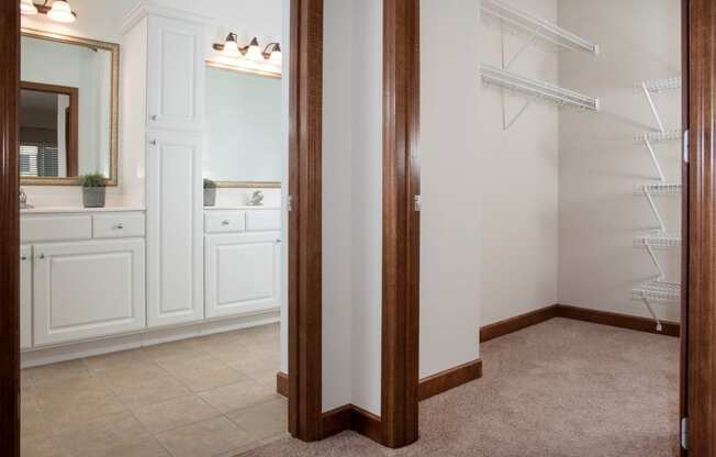 Walk-in closet with master bath and dual sink