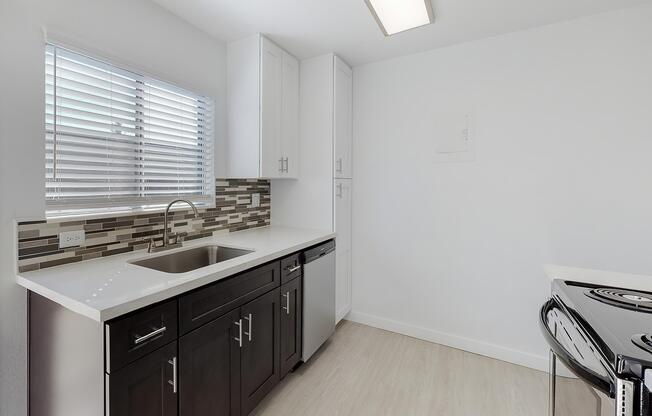 a kitchen with a window in a room