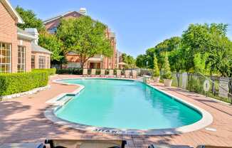 Enjoy a cool swim in our sparkling pool with golf course views at Turnberry Isle Apartments in Dallas, TX offers 1,2 and 3 Bedroom Apartment Homes.