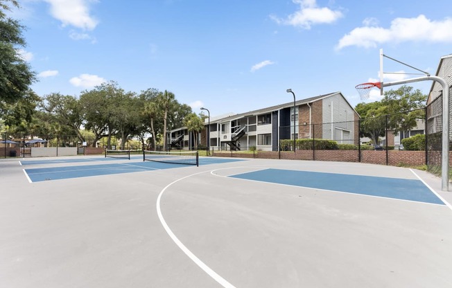 the basketball court at the whispering winds apartments in pearland tx