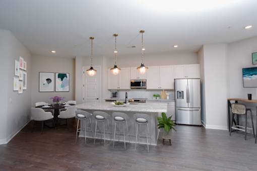 a kitchen with a large center island next to a dining room at Fairfax, Grandview, Ohio