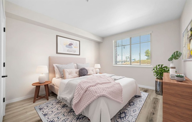 a bedroom with a large bed and a large window