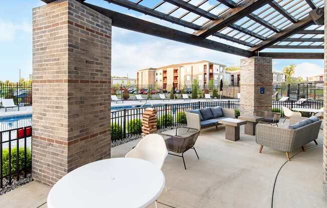 a patio with furniture and a pool at aria on the strip apartments at Echo Park at Perry Crossing Apartments, Plainfield, IN