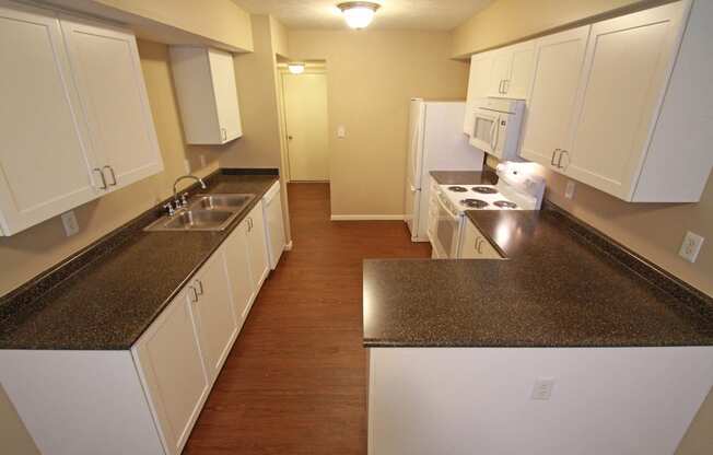 This is a photo of the kitchen in the 1490 square foot 3 bedroom Presidential at Washington Place Apartments in Washington Township, OH.