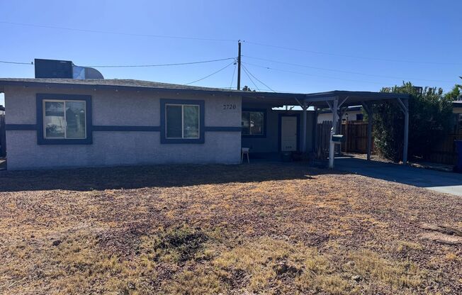 Colorful bungalow style home with plenty of yard.