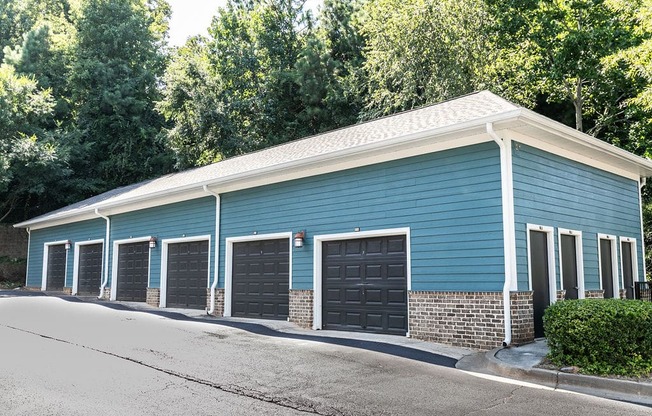 a blue building with a row of garage doors