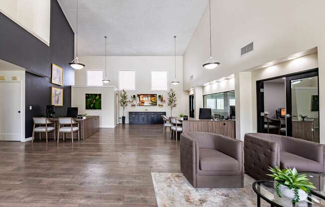 A living room with a couch, chairs, and a coffee table.