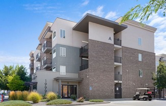 an apartment building with a golf cart parked in front of it
