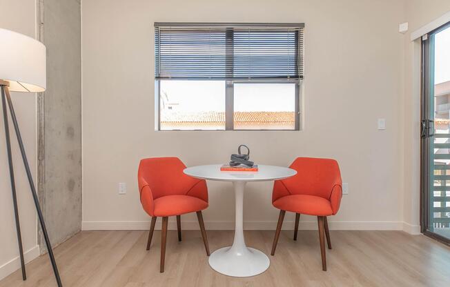 a living room filled with furniture and a lamp