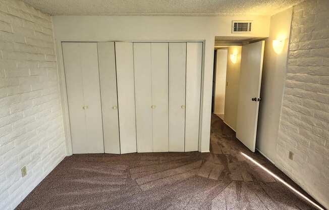 2x2 Downstairs Classic Guest Bedroom with Closets at Mission Palms Apartment Homes in Tucson AZ