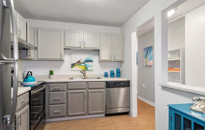 Kitchen with stainless steel appliances and white cabinets