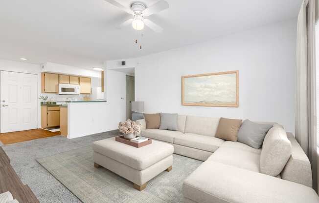 a living room with a large couch and a coffee table