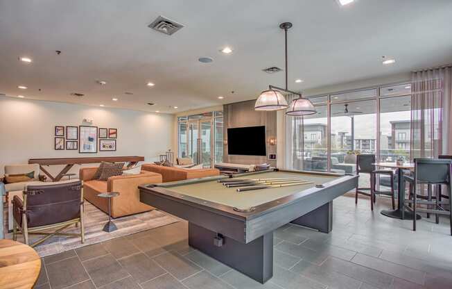 a games room with a pool table and a flat screen tv at Presidium Revelstoke, Fort Worth