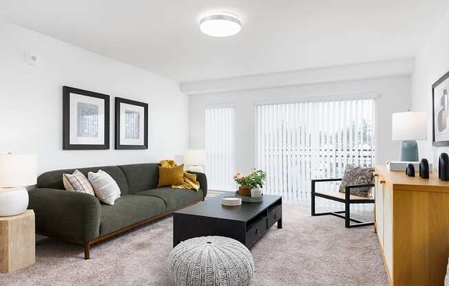 a living room with white walls and carpet at QUINN BY VINTAGE, Shoreline, Washington