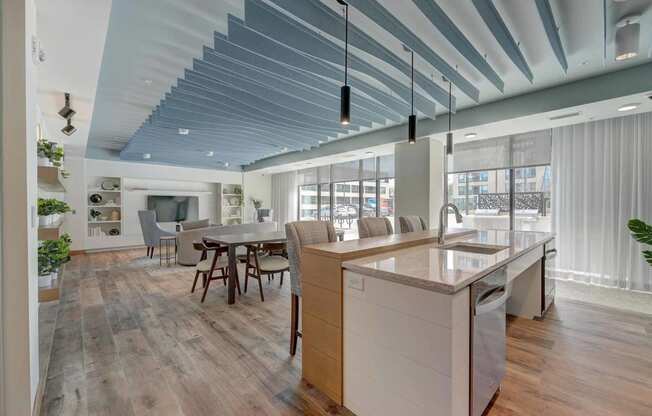 a kitchen with an island and a dining table