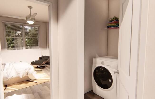 a small laundry room with a washer and dryer at Brownstones at Palisade Park, Colorado