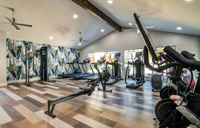 the home gym has plenty of exercise equipment and a large wall mural  at Veranda La Mesa, La Mesa, 91942